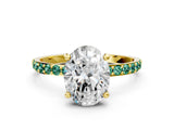 Yellow gold Oval Cut Diamond Solitaire Ring with Round with Green Sapphire side stone Pavé Band and Prong Setting
