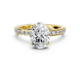 Yellow gold Oval Cut Diamond Solitaire with Pave Band and Four-Prong Setting