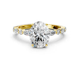 Yellow gold Oval Cut Diamond Solitaire with Side Stones on a Pavé Band and Four-Prong Setting_92