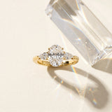 18K Yellow Gold 1.56 Carat D VS1 Oval Diamond Three-Stone Ring with Pear Side Stones and Prong Setting