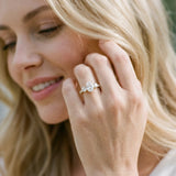 Yellow gold Oval Cut Diamond Three-Stone Ring with Round Side Stones and Pavé Band_130