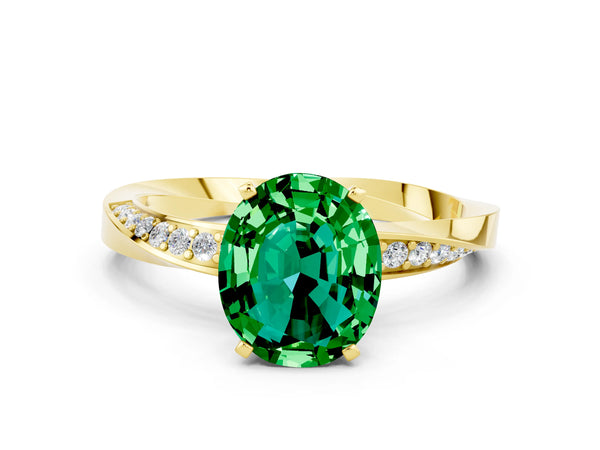 Yellow gold Oval Cut Emerald Engagement Ring with Side Stone Accents and Four-Prong Setting