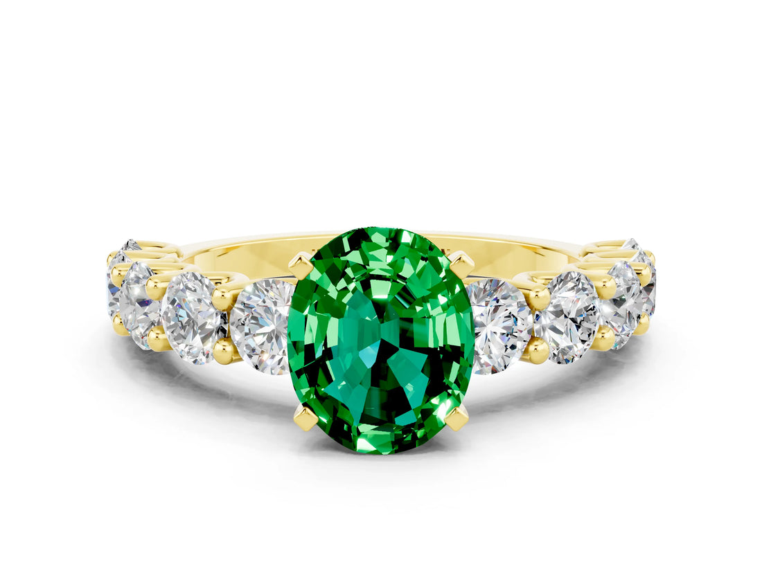 Yellow gold Oval Cut Emerald Prong Setting with Side Stones on a Pave Band