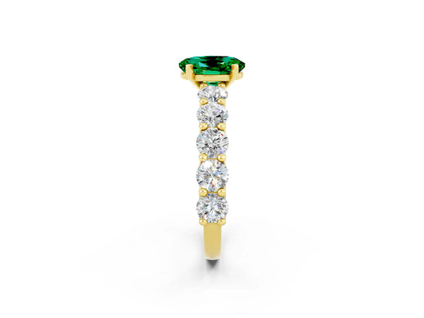 Yellow gold Oval Cut Emerald Prong Setting with Side Stones on a Pave Band
