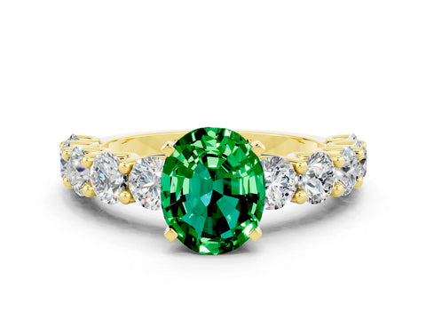 Yellow gold Oval Cut Emerald Prong Setting with Side Stones on a Pave Band