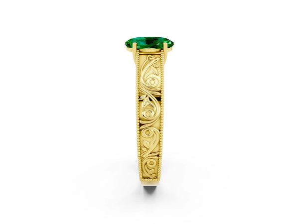 Yellow gold Oval Cut Emerald Solitaire Ring with Engraved Band and Four-Prong Setting