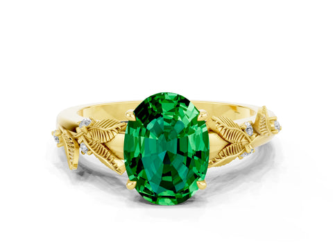 Yellow gold Oval Cut Emerald Solitaire Ring with Leaf Motif Band and Four-Prong Setting