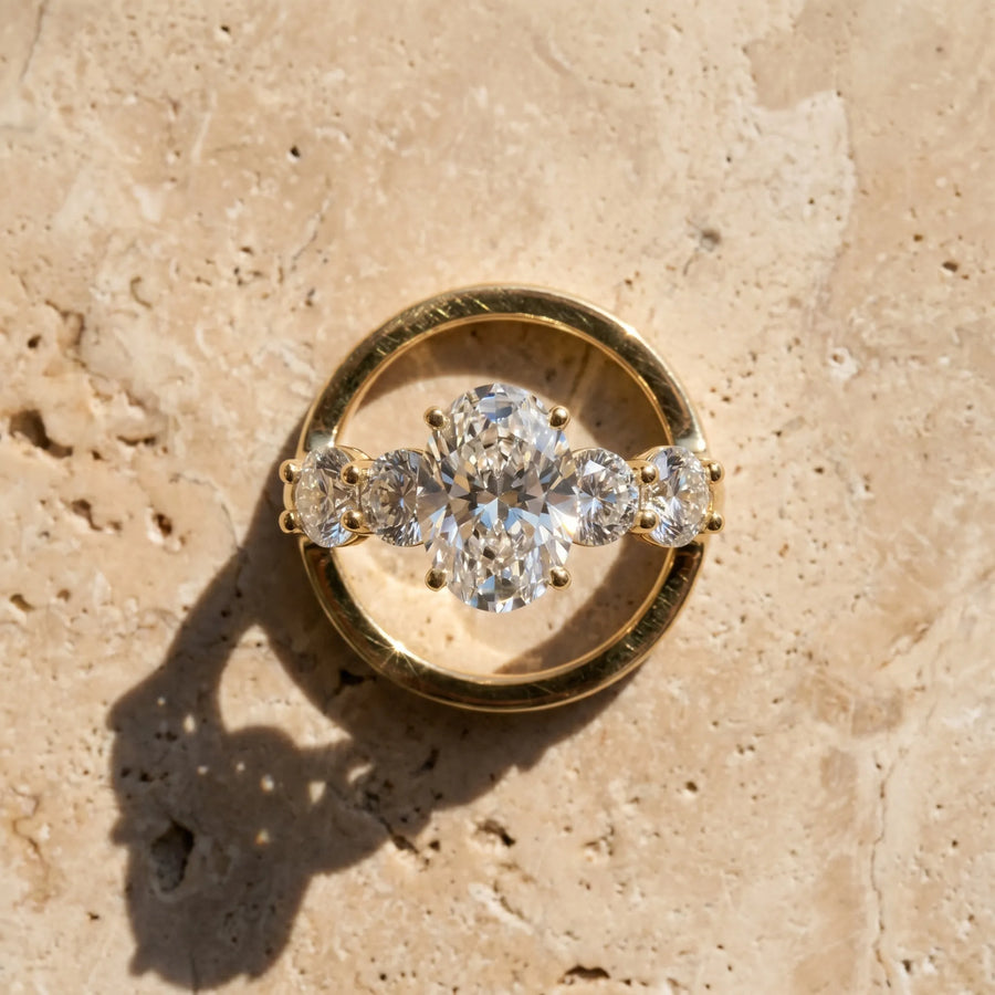 Yellow gold Oval Cut Five-Stone Prong Set Diamond Ring with Classic Band