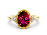 Yellow gold Oval Cut Garnet Halo Ring with Tapered Band and Four-Prong Setting