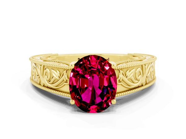 Yellow gold Oval Cut Garnet Solitaire Ring with Engraved Band and Four-Prong Setting