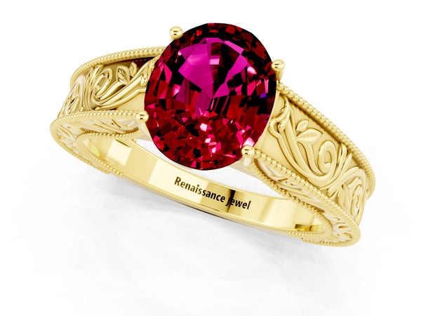 Yellow gold Oval Cut Garnet Solitaire Ring with Engraved Band and Four-Prong Setting