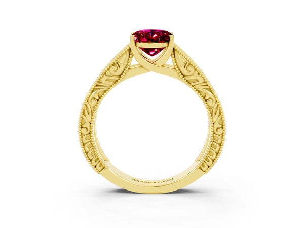 Yellow gold Oval Cut Garnet Solitaire Ring with Engraved Band and Four-Prong Setting