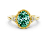 Yellow gold Oval Cut Green Sapphire Halo Ring with Tapered Band and Four-Prong Setting