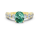 Yellow gold Oval Cut Green Sapphire Prong Setting with Side Stones on a Pave Band