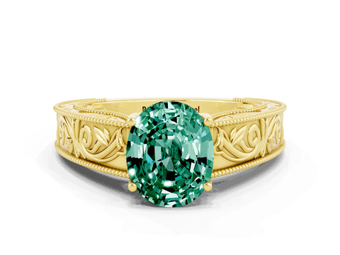 Yellow gold Oval Cut Green Sapphire Solitaire Ring with Engraved Band and Four-Prong Setting