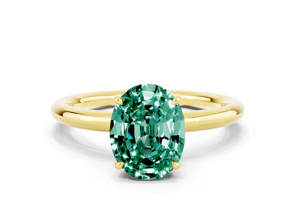 Yellow gold Oval Cut Green Sapphire Solitaire Ring with Thin Band and Four-Prong Setting