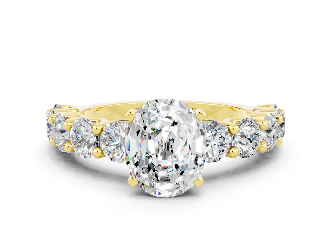 Yellow gold Oval Cut Moissanite Prong Setting with Side Stones on a Pave Band
