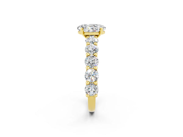 Yellow gold Oval Cut Moissanite Prong Setting with Side Stones on a Pave Band