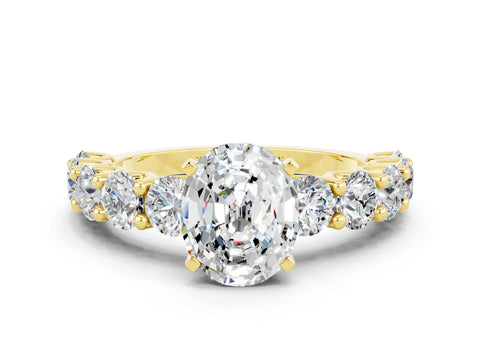 Yellow gold Oval Cut Moissanite Prong Setting with Side Stones on a Pave Band