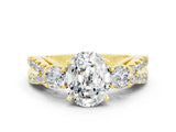 Yellow gold Oval Cut Moissanite Three-Stone Ring with Pavé Split Shank and Four-Prong Setting_12