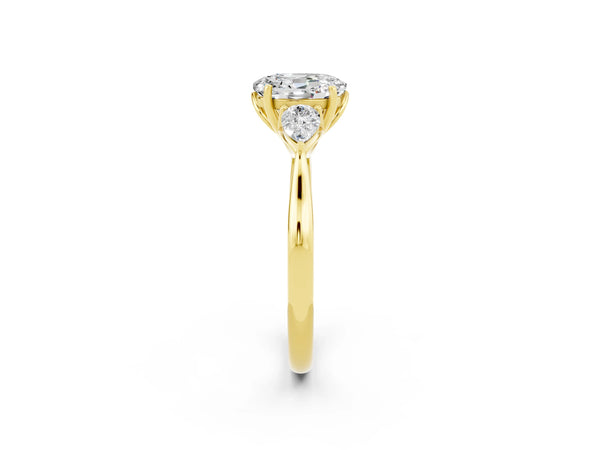 Yellow gold Oval Cut Moissanite Three-Stone Ring with Pear  Side Stones and Prong Setting