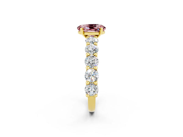 Yellow gold Oval Cut Morganite Prong Setting with Side Stones on a Pave Band