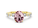 Yellow gold Oval Cut Morganite Solitaire with Side Stones on a Pavé Band and Four-Prong Setting