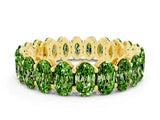 Yellow gold Oval Cut Peridot Eternity Band with Shared Prong Setting