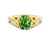 Yellow gold Oval Cut Peridot Solitaire Engagement Ring with Celtic Knot Band and Four-Prong Setting