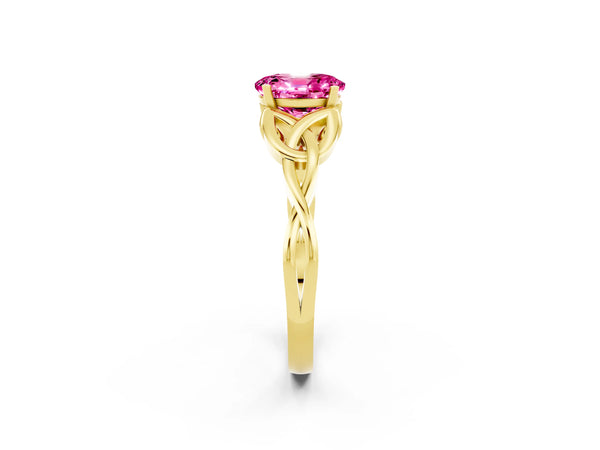 Yellow gold Oval Cut Pink Sapphire Solitaire Engagement Ring with Celtic Knot Band and Four-Prong Setting