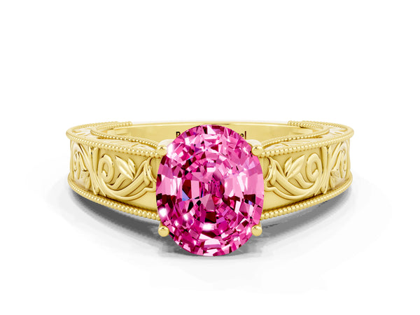 Yellow gold Oval Cut Pink Sapphire Solitaire Ring with Engraved Band and Four-Prong Setting