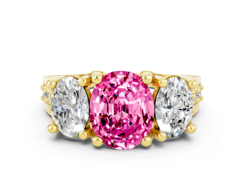 Yellow gold Oval Cut Pink Sapphire Three-Stone Ring with Channel Set Band and Four-Prong Setting