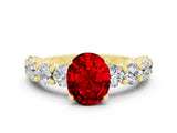 Yellow gold Oval Cut Ruby Prong Setting with Side Stones on a Pave Band