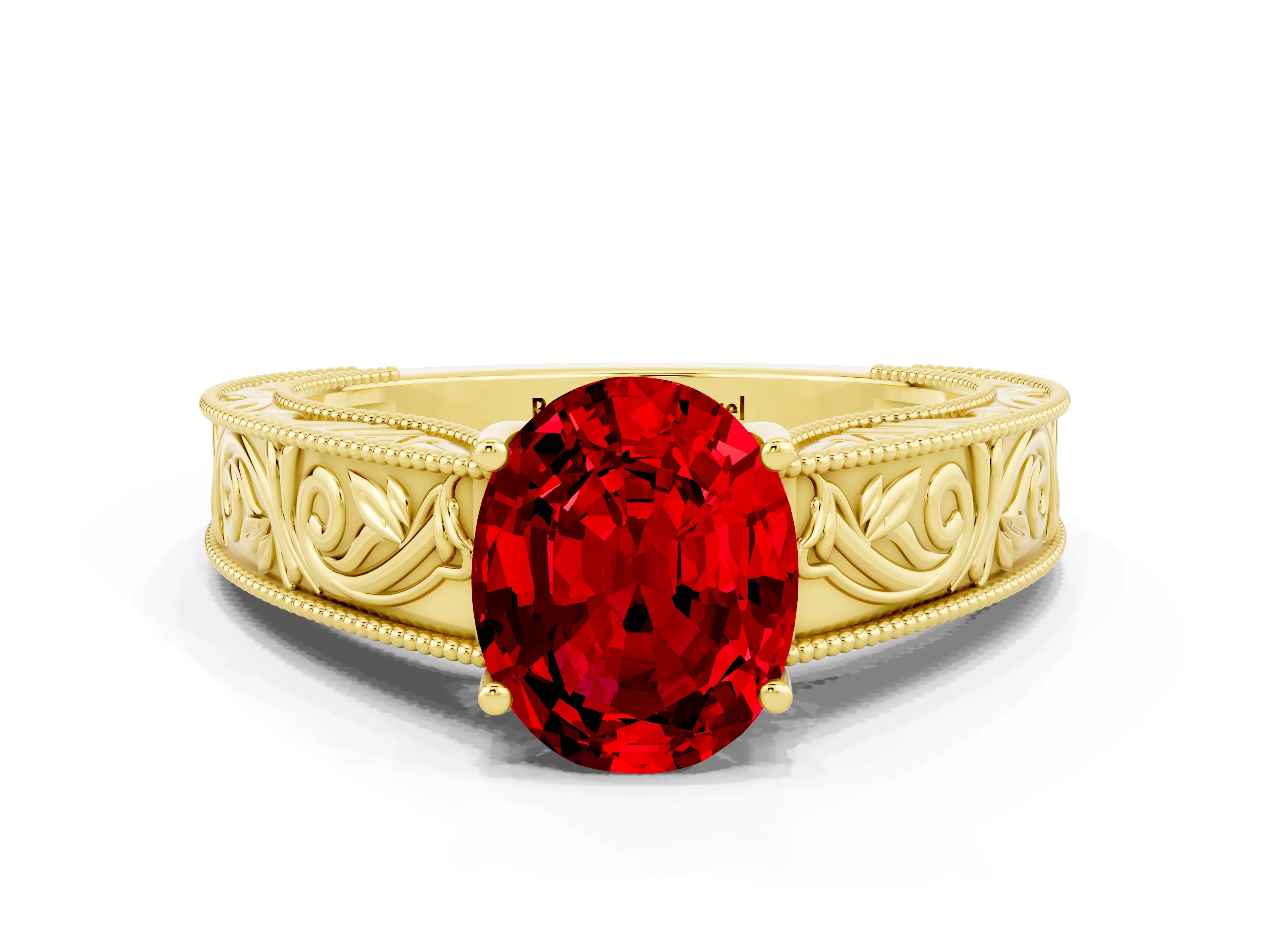 Yellow gold Oval Cut Ruby Solitaire Ring with Engraved Band and Four-Prong Setting