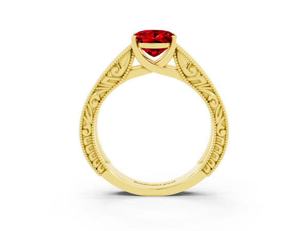 Yellow gold Oval Cut Ruby Solitaire Ring with Engraved Band and Four-Prong Setting