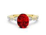 Yellow gold Oval Cut Ruby Solitaire with Side Stones on a Pavé Band and Four-Prong Setting
