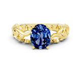 Yellow gold Oval Cut Solitaire Blue Sapphire Leaf-Inspired Vine Band Ring with Prong Setting