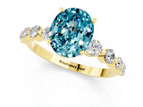 Yellow gold Oval Cut Solitaire Blue Topaz Ring with Pave Band and Four-Prong Setting_1
