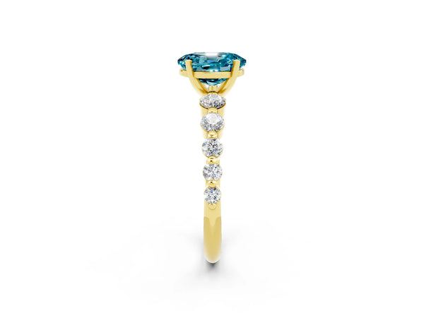Yellow gold Oval Cut Solitaire Blue Topaz Ring with Pave Band and Four-Prong Setting