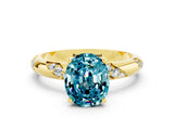 Yellow gold Oval Cut Solitaire Diamond Engagement Ring with Twisted Pave Band and Four-Prong Setting