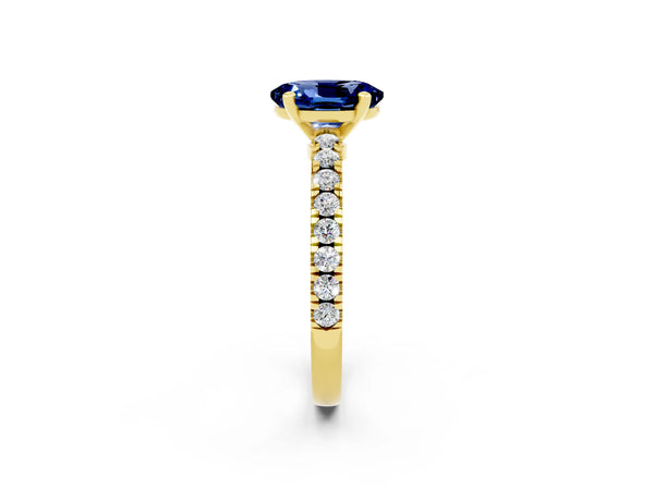 Yellow gold Oval Cut Solitaire Blue Sapphire with Pavé Band and Four-Prong Setting