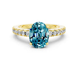 Yellow gold Oval Cut Solitaire Diamond with Pavé Band and Four-Prong Setting