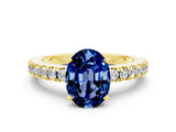 Yellow gold Oval Cut Solitaire Diamond with Pavé Band and Four-Prong Setting
