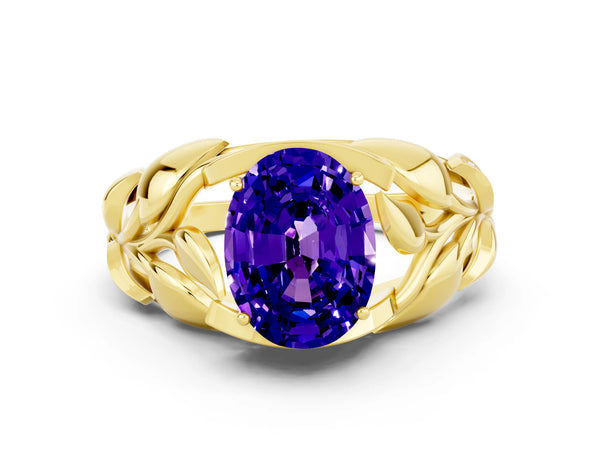 Yellow gold Oval Cut Tanzanite Leaf-Inspired Engagement Ring with Round Accents and Prong Setting