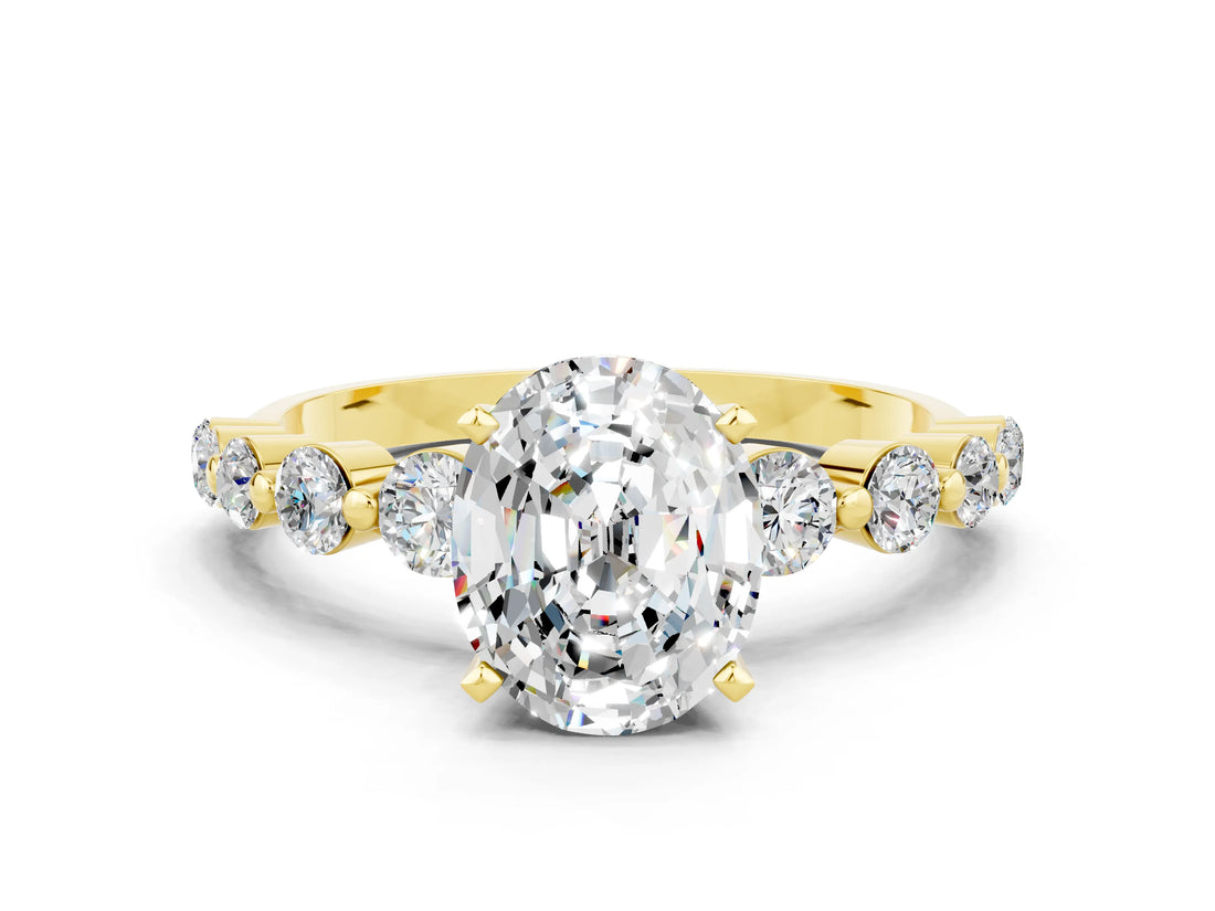 Yellow gold Oval Cut Solitaire Moissanite Ring with Pave Band and Four-Prong Setting