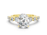 Yellow gold Oval Cut Solitaire Moissanite Ring with Pave Band and Four-Prong Setting