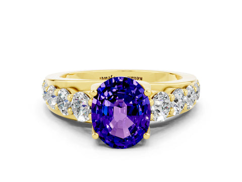 Yellow gold Oval Cut Tanzanite Engagement Ring with Pavé Band and Four-Prong Setting