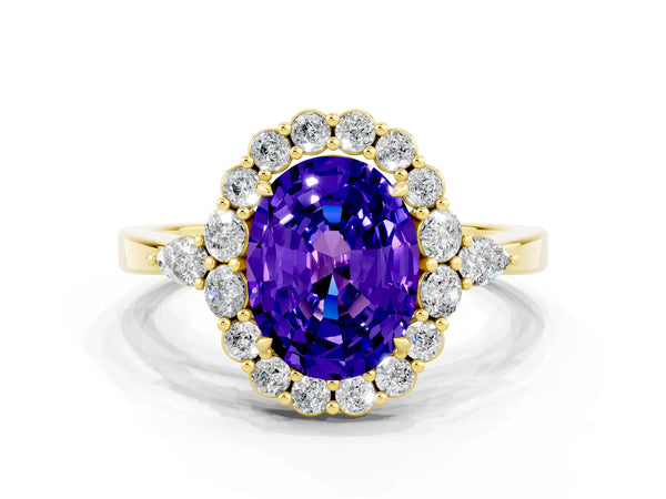 Yellow gold Oval Cut Tanzanite Halo Ring with Pear Side Stones and Prong Setting