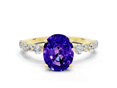 Yellow gold Oval Cut Tanzanite Prong Set Engagement Ring with Pavé Band