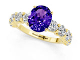 Yellow gold Oval Cut Tanzanite Prong Setting with Side Stones on a Pave Band_1